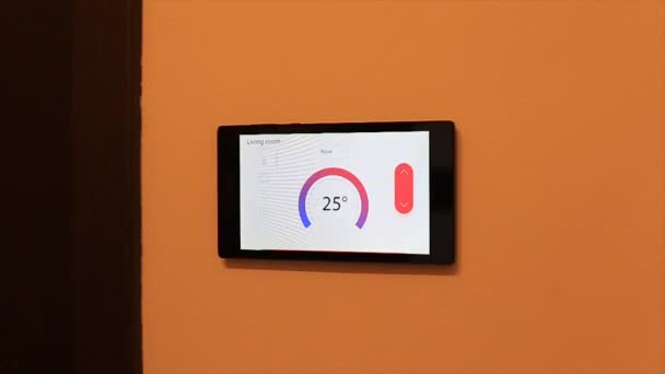 Smart home climate control device on a wall — Stock Video