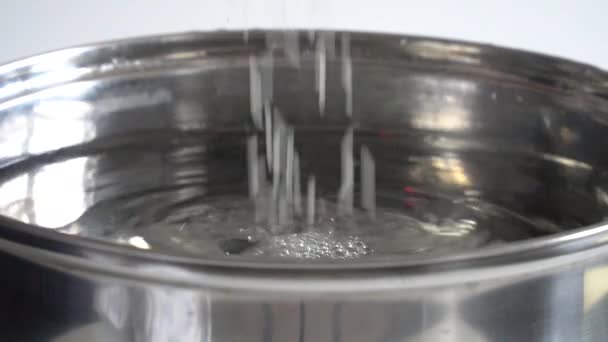 Slow motion of white rice falling in water — Stock Video