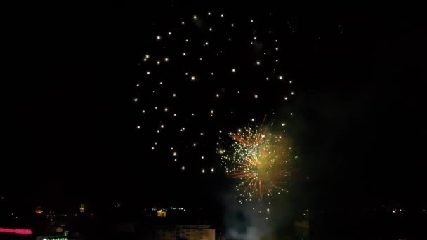 Aerial view of a drone flying close to a fireworks at night