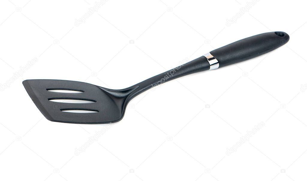 Black plastic kitchen spatula isolated on white background
