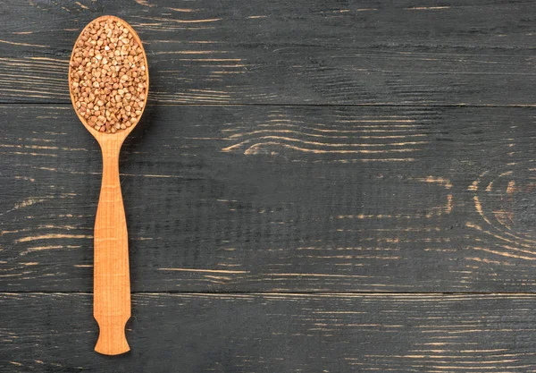 Cucchiaio Grano Saraceno Secco Uno Sfondo Legno Vuoto — Foto Stock