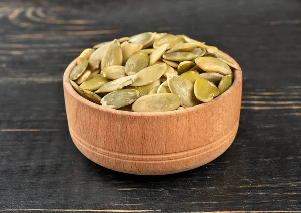 Pumpkin seed kernels in bowl — Stock Photo, Image