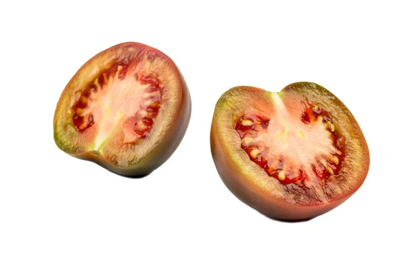 Две половинки помидора кумато — стоковое фото