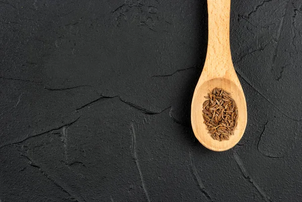 Dry cumin in spoon — Stock Photo, Image