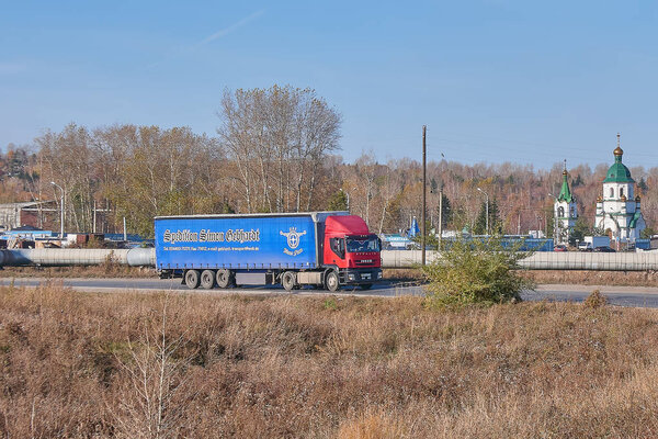 Krasnoyarsk, Russia - October 13, 2018: Iveco truck moves on an outcome on Northern the Highway. Front right view.