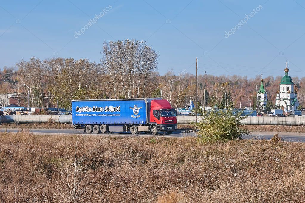 Krasnoyarsk, Russia - October 13, 2018: Iveco truck moves on an outcome on Northern the Highway. Front right view.