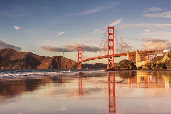 Awesome reflections on sand of Golden gate bridge. View from Marshal\'s beach.