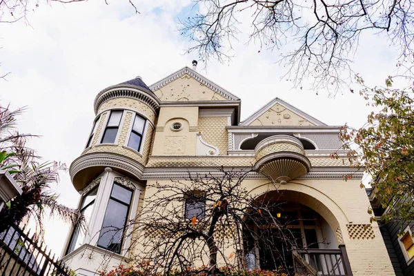 Fancy Victorian house exterior with typical balcony and entrance. San Francisco, California.