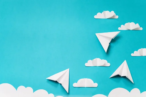 Paper cut clouds and origami planes. Creative concept for banner/landing/background designs.