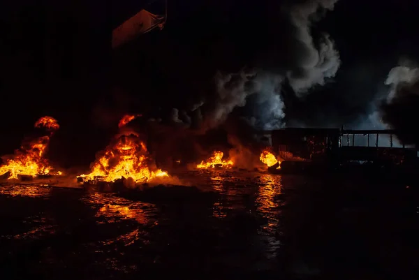 Riots, burning tires, bonfires in the night