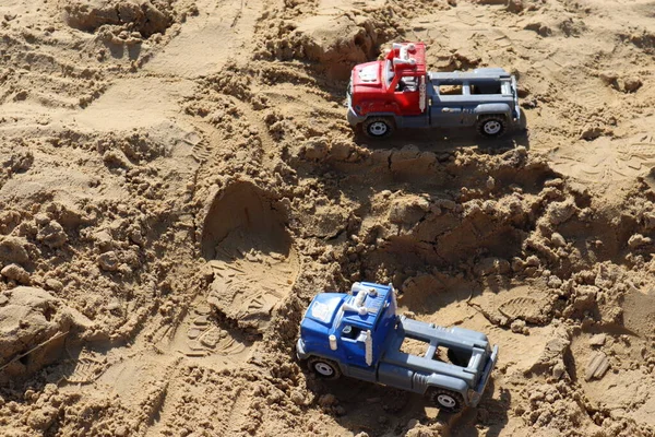 children\'s toys in the sandbox on a warm summer day