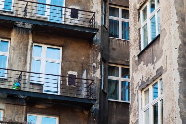 the facade of the building with the windows and the roof Krakow