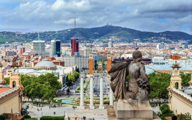 BARCELONA, SPAIN - OCTOBER 10, 2018: View form Montjuic hill and National museum of Catalan to the city and Plaza de Espana, including the four columns and the Venetian towers.