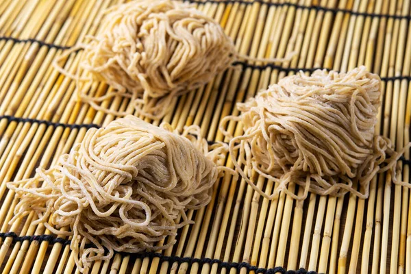 Chinese dry egg noodles on table