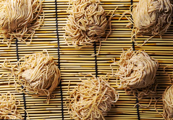 Top view Chinese dry egg noodles on table