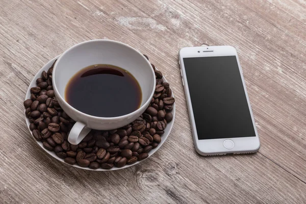 Cup Coffee Coffee Beans Phone Wooden Table — Stock Photo, Image