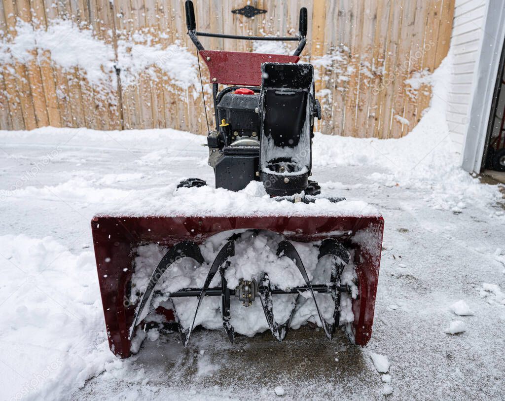 snowblower is packed with wet snow and must be cleared