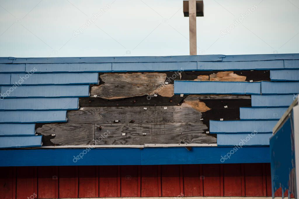 old wooden roof with a broken window