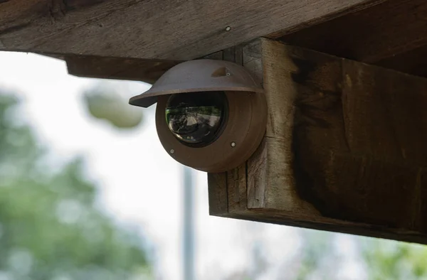 discreet security camera is cleverly hidden to watch the nearby