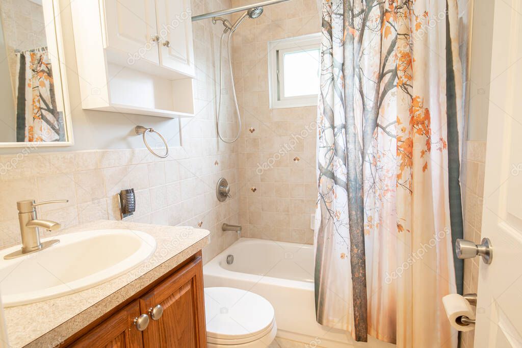 bathroom with ceramic tile has been professionally updated