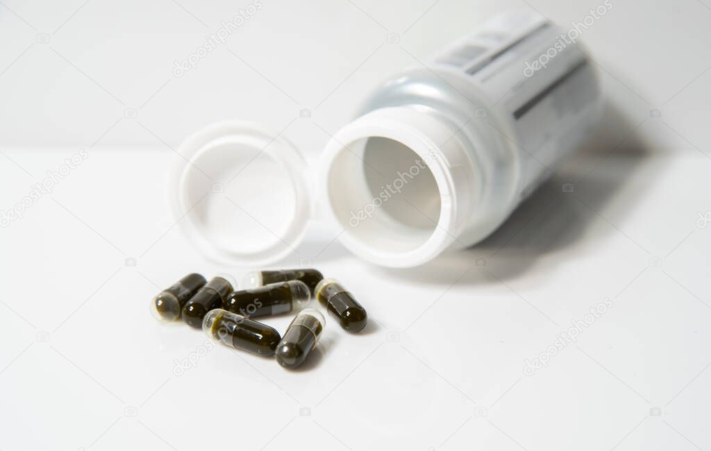 CBD capsules have been poured out of the bottle