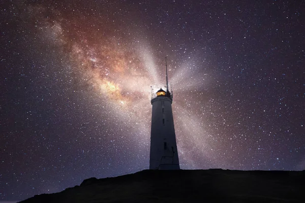 old lighthouse with the milky way galaxy in the night