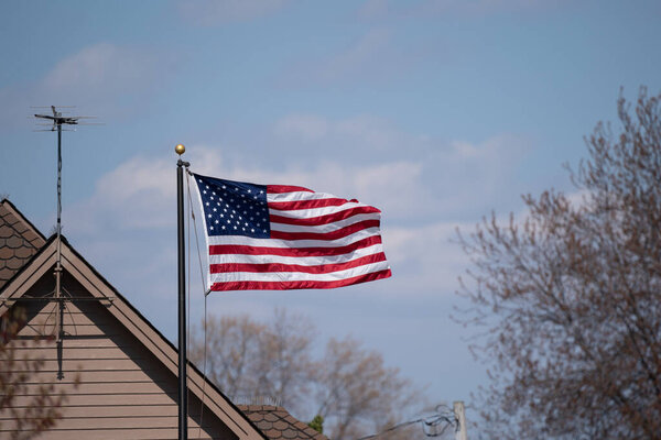 american flag on the roof of the house
