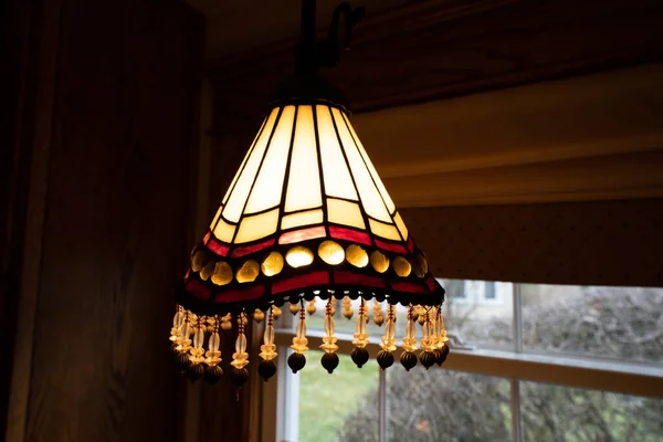 stained glass light fixture glows brightly