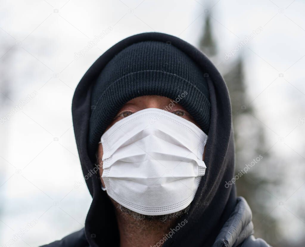 man wearing protective breathing mask to avoid germs