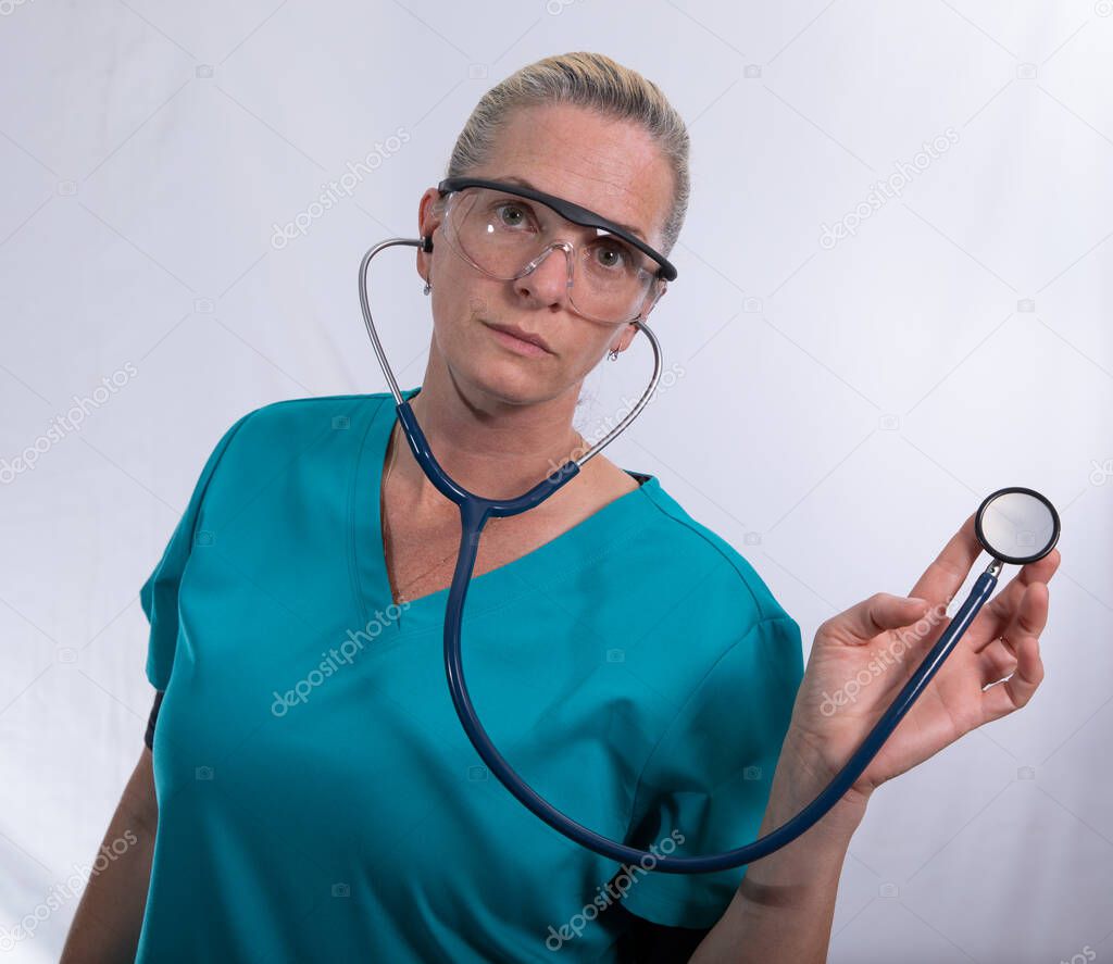 female doctor with a stethoscope has arrived to listen to your heart