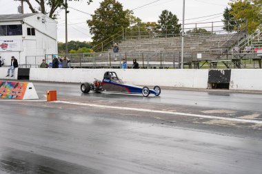 Drivers testing their cars at a free event open to the public and free to take pictures at Milan Dragway on 10-03-2020 clipart
