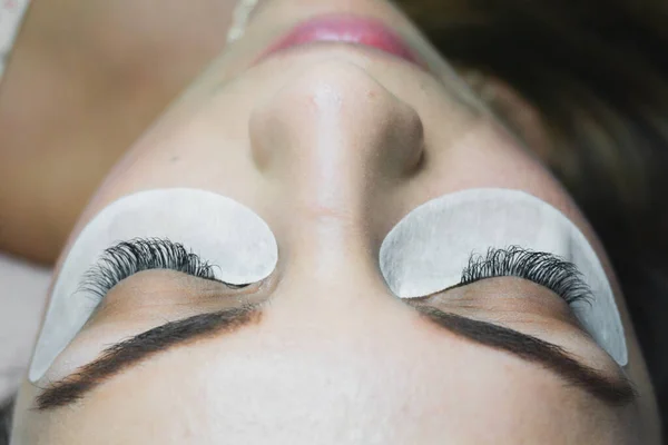 Young Woman Getting Eyelash Extension Procedure