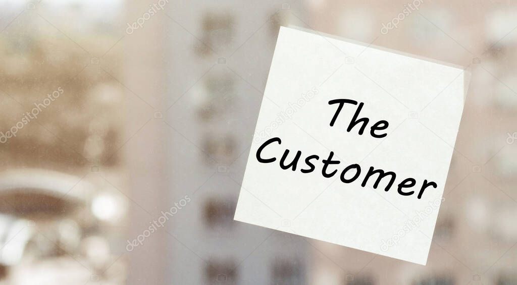 white paper with text The Customer on the window