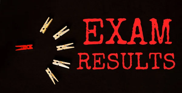 red and brown text Exam Results on the black background