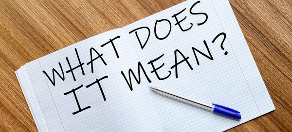 Пустой блокнот и ручка. Изолирован на белом. whith text what does it mean 