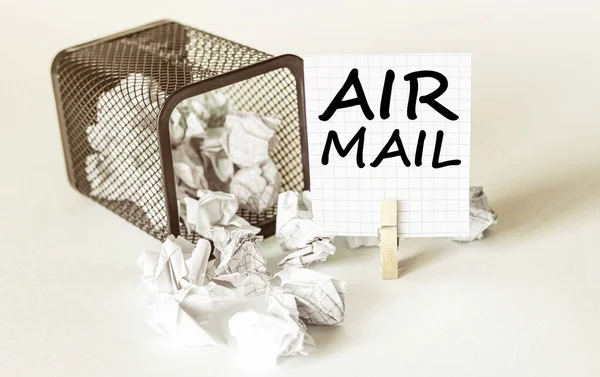 white lumps of paper fall out of the case to the paper in the inscription Air Mail