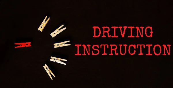 red and brown text Driving Instruction on the black background