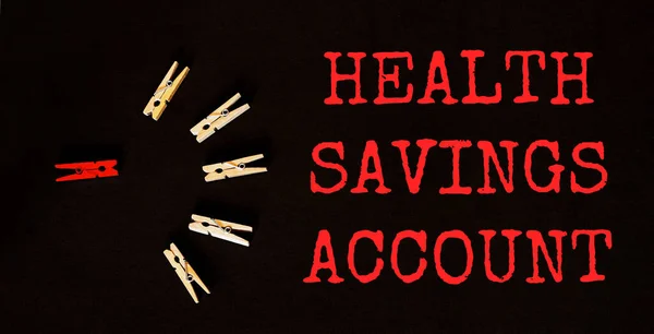 red and brown text Health Savings Account on the black background