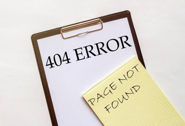 404 nolu metin içeren beyaz ve sarı kağıt Kırtasiyeli beyaz bir arkaplanda bulunamadı