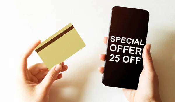 gold card and phone with text disaster recover plan Special Offer 25 Off in the female hands