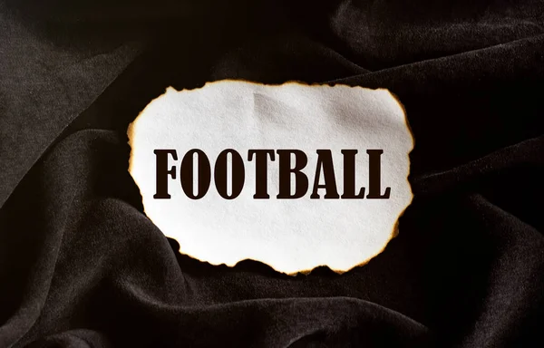 Queimado Pedaço Papel Branco Com Texto Futebol Fundo Tecido Preto — Fotografia de Stock