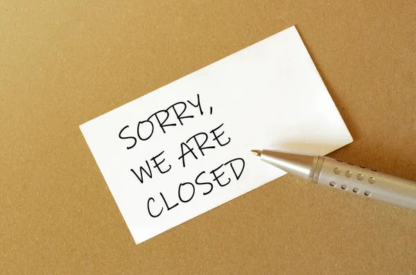 Pen White Paper Text Sorry Closed Brown Background — Stock Photo, Image