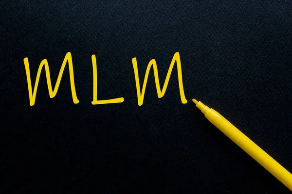 MLM Multi Level Marketing Yellow Pen with yellow text own rent at the black background