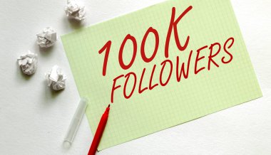 Yazılı sarı kağıt. 100K. Kırmızı kalemli beyaz üzerine takipçiler.