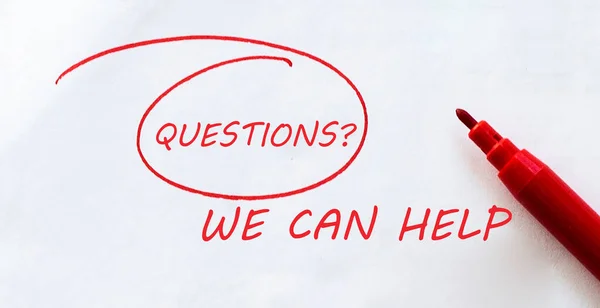 white paper with text Questions We Can Help on the white with red marker