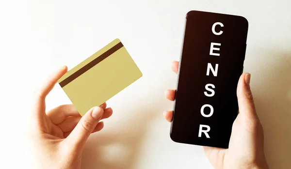 gold card and phone with text disaster recover plan Censor in the female hands