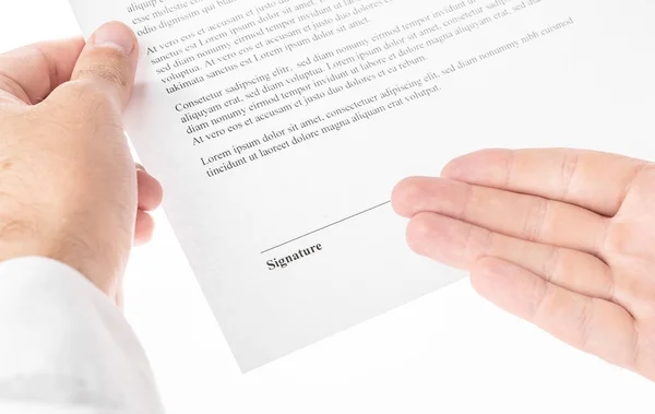 businessman holds a contract for signature on a white background. business concept.