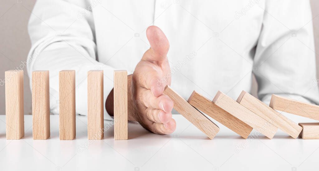 male businessman, Jenga, wooden blocks. a concept about career growth, insurance