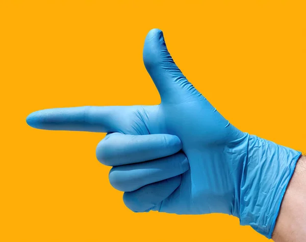Закрытая Рука Открытым Большим Указательным Пальцами Форме Пистолета Голубой Перчаткой — стоковое фото