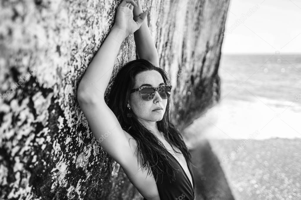 Long hair bruntte girl relaxing on the beach 